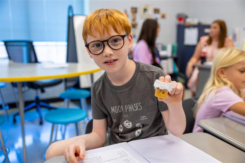 Students smile in science class